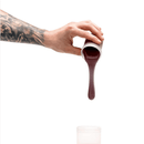 Hand pouring deep skin tone silicone refill for homemade dildo molding into container