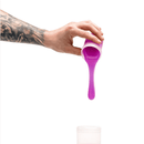 Pouring neon purple silicone from Clone-A-Willy refill pack into container