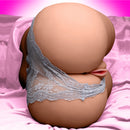 Mistress Sophia Doggie Style Masturbator Medium with textured entries and realistic design on pink bedding.