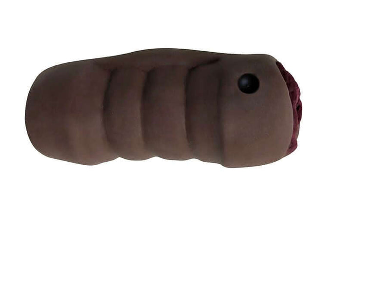 Mistress Brandy and Buffy Vibrating BioSkin Stroker in chocolate with textured design for enhanced sensations.