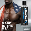 JOCK Premium Water Based Lubricant 8 Oz bottle with muscular man and American flag, highlighting quality and safety.