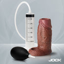 Jock Squirting Silicone Penis Enhancer Ball Strap Dark with pumping device, designed for enhanced pleasure experience.