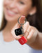 "Super Fun Key Chain Sex Dice with playful design held towards the camera"