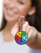 Woman holding a colorful keychain with a playful spinner, adding fun and spice to everyday keys.