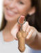 Woman holding a novelty squishy penis keychain from Little Genie to add fun to keyrings.