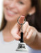 Woman holding novelty "Ring for Oral" keychain from Little Genie's Super Fun Key Chain collection, adding humor to any keyring.