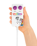 Hand holding the control panel of The Cowgirl Unicorn Premium Sex Machine featuring two knobs for vibration and rotation.