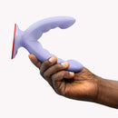 Hand holding Fun Factory Ryde Grinding Dildo Purple showcasing its innovative dual-shaft design and ribbed texture.