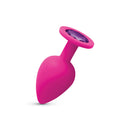 Gemma Purple Gem Pink Silicone Anal Plug Large with a smooth teardrop shape and a purple gemstone.