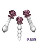 Dr Tush's Sacred Glass Rose Anal Plug Set featuring three elegant borosilicate glass pieces with rose accents.