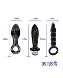 Dr Tushs Dark Curiosity Collection Anal Plug Set Glass showcasing three distinct glass plugs with measurements.
