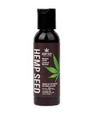 Earthly Body Hemp Massage Lotion 2 Oz Naked in the Woods bottle featuring hemp seed design.