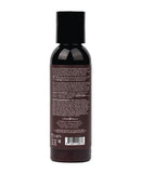Earthly Body Hemp Massage Lotion 2 Oz Naked in the Woods product back view with ingredient details.
