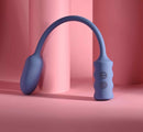 Gender X Egg-Streme Rechargeable Silicone Egg Blue on a pink background showcasing its sleek design and controls.