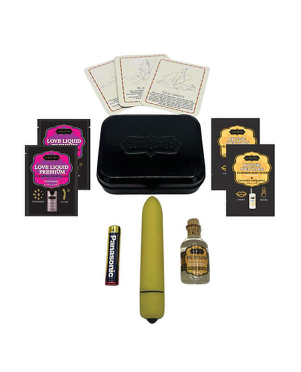 Kama Sutra Weekender Vibe Kit with mini bullet vibe, sensual essentials, coconut pineapple theme, packaging, cards, and batteries.
