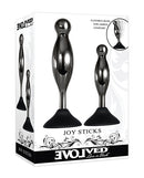 Evolved Joy Sticks 2 Piece Butt Plug Set Black Chrome packaging showcasing sleek design and suction base for enhanced pleasure.