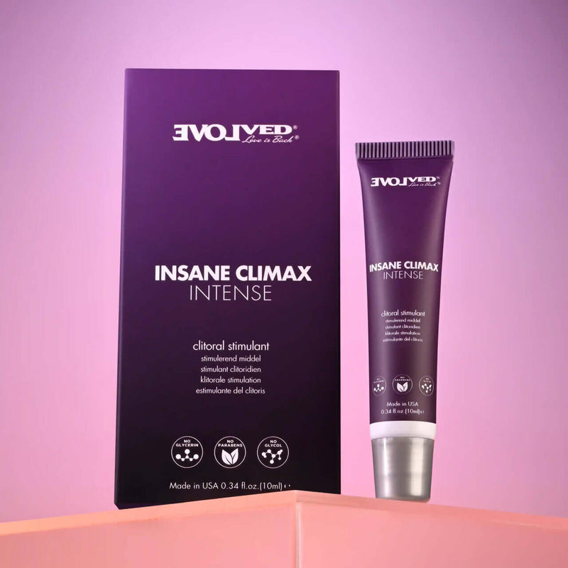 Evolved Insane Climax Intense 0.34 oz clitoral stimulant product packaging and tube on stylish background.