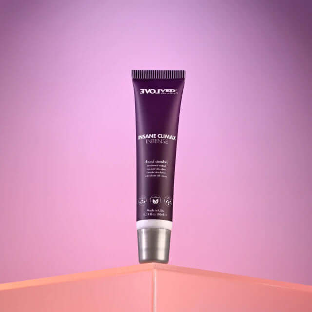 Evolved Insane Climax Intense clitoral stimulant tube on a pastel background, heightening intimate pleasure.
