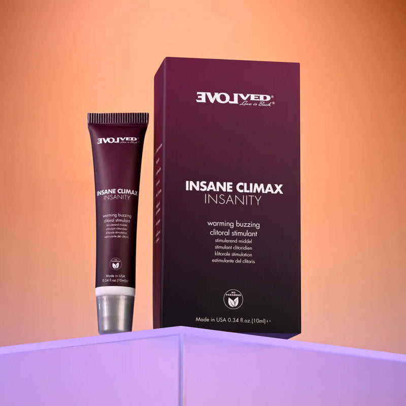 Evolved Insane Climax Insanity warming buzzing clitoral stimulant 0.34 oz packaging with product on display.