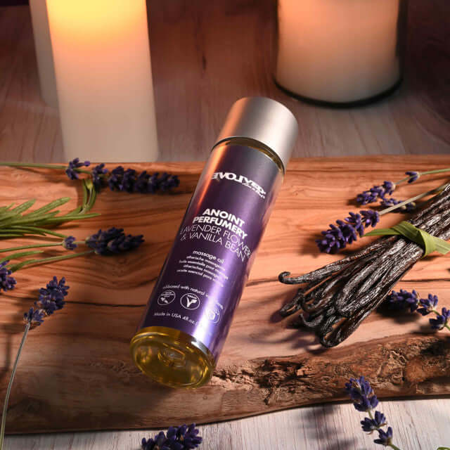 Anoint Perfumery Massage Oil Lavender Flower & Vanilla Bean in a serene setting with lavender and candles.
