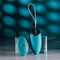 Evolved Oval Office remote control vibrating egg and wireless remote on a blue background.