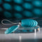 Evolved Oval Office remote control vibrating egg in teal color, shown on a clear stand with matching remote control, ideal for discreet pleasure.