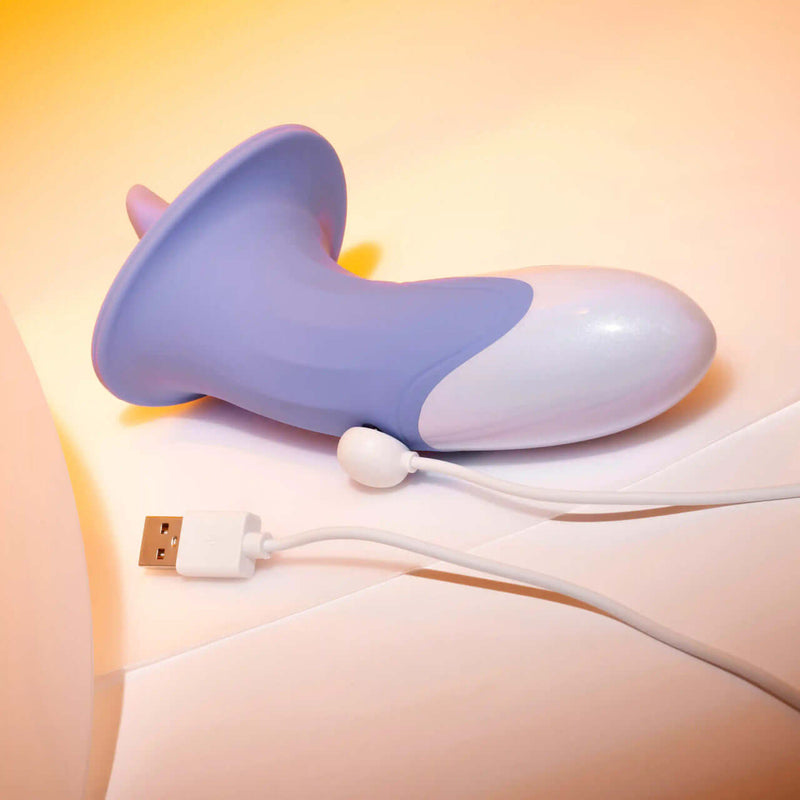 Evolved Lix & Kisses Twirling Tongue Vibrator with USB charging cable, featuring 8 speeds and vibrant design for ultimate pleasure.