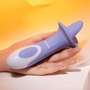 Purple Evolved Lix & Kisses Twirling Tongue Vibrator with 8 speeds held in hand against a soft yellow background