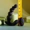 Black rechargeable silicone vibrating anal beads with remote control, showcasing graduated beads and measurement tape.