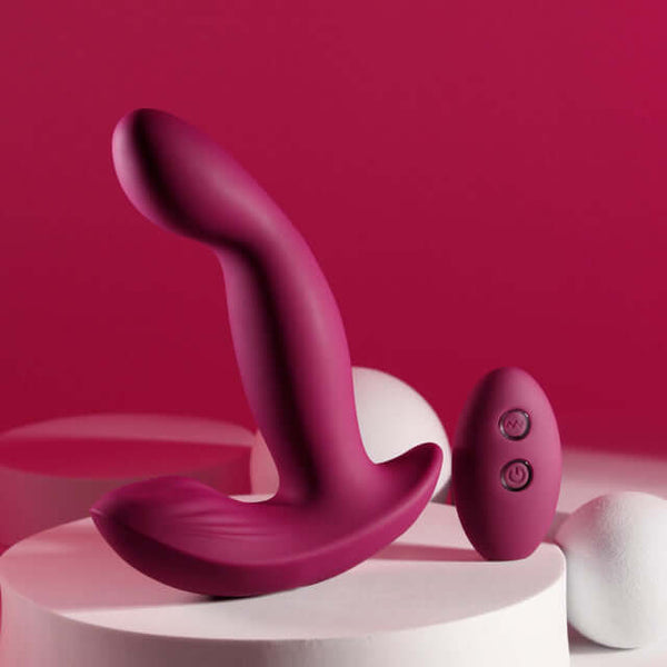 Rechargeable silicone dual vibrator with remote control in red, designed for intense pleasure and independent motor operation.