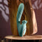 Poseable thrusting vibrator with rotating prongs on wooden display.