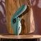 Poseable thrusting vibrator with rotating prongs on wooden stand