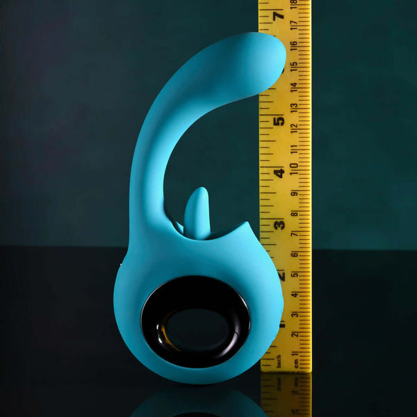 Evolved How Many Licks Vibrator with G-Spot and Tongue Stimulation next to ruler for size reference