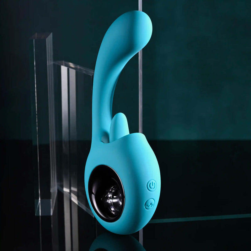 Evolved How Many Licks Vibrator in teal with a flexible licking tongue and G-spot stimulation design.