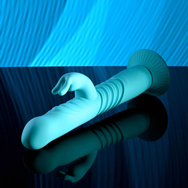 Blue Bunny Hop rechargeable silicone rabbit vibrator with thrusting feature and suction cup base.