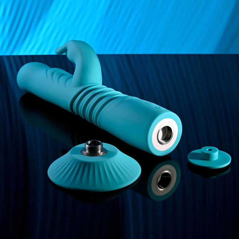 Bunny Hop rechargeable silicone rabbit vibrator in blue with suction cup base and detail parts on mirror surface.