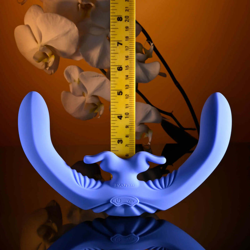 Lovebirds rechargeable silicone dual vibrator in blue, measuring 7 inches with curved design and textured body.