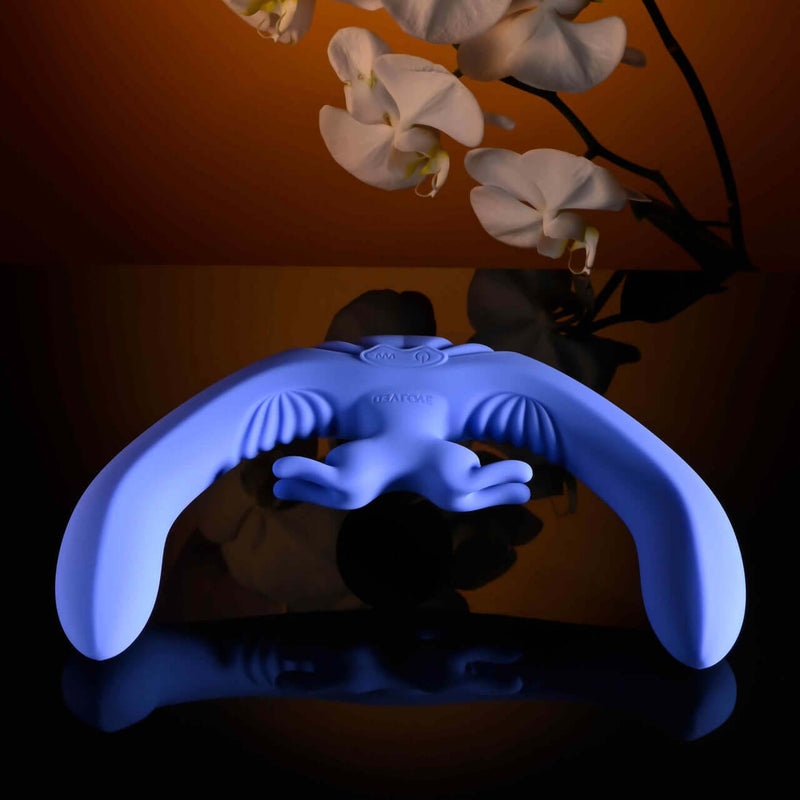 Blue Lovebirds rechargeable silicone dual vibrator with remote, featuring rabbit stimulator and sleek design.