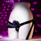 Giving Vibes Rechargeable Silicone Triple Vibrator on a mannequin with adjustable harness straps and disco background.