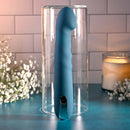 Rechargeable silicone dual vibrator in blue, showcased in a glass container, perfect for intimate pleasure.