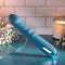 Queen of All Trades blue silicone dual vibrator with thrusting shaft and rotating beads for intense pleasure.