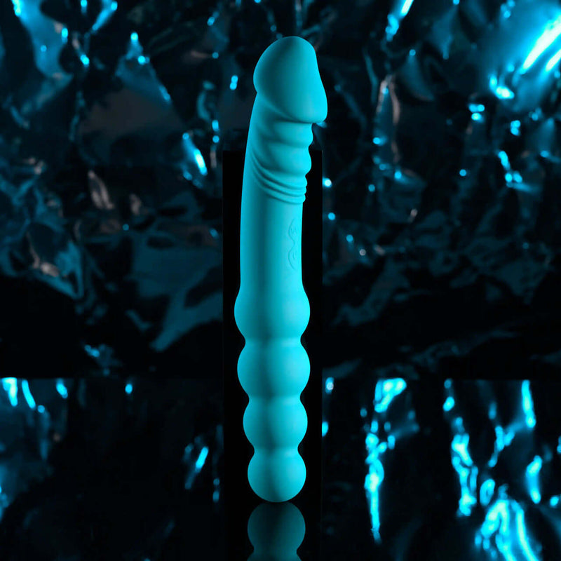 Blue silicone dual-ended vibrator with textured shaft and beaded design, perfect for versatile pleasure experiences.