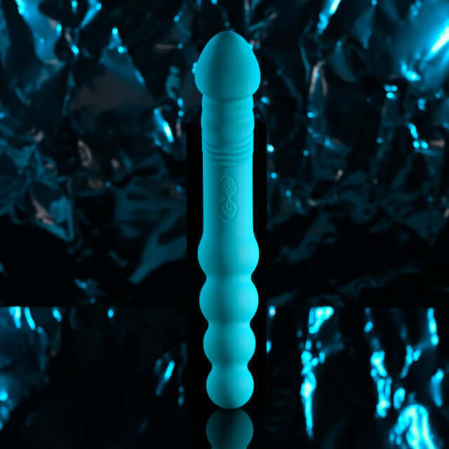 Blue flip flop rechargeable silicone dual end vibrator with textured shaft and pleasure bulbs.