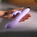 Spinderella Rechargeable Silicone Rabbit Vibrator Purple held in a hand showing its sleek design and features.