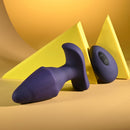Starburst Expandable Anal Plug with Remote Purple featured against a yellow backdrop, showcasing its unique design.