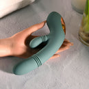 Evolved Rub Me Tender G-spot Clitoral Stimulator resting on a hand with soft background, showcasing its elegant design.