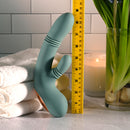 Evolved Rub Me Tender G-spot Clitoral Stimulator displayed alongside a ruler for size reference in a soothing bathroom setting.