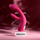 Gentle Persuasion Vibrator with Clitoral Stimulator Red displayed in an elegant setting, highlighting its sleek design and features.