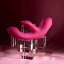 Gentle Persuasion Vibrator with Clitoral Stimulator Red displayed on a clear block stand, showcasing its sleek design.