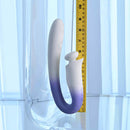 Spring Loaded Rechargeable Silicone Dual Vibrator Purple next to a measuring tape for size reference.